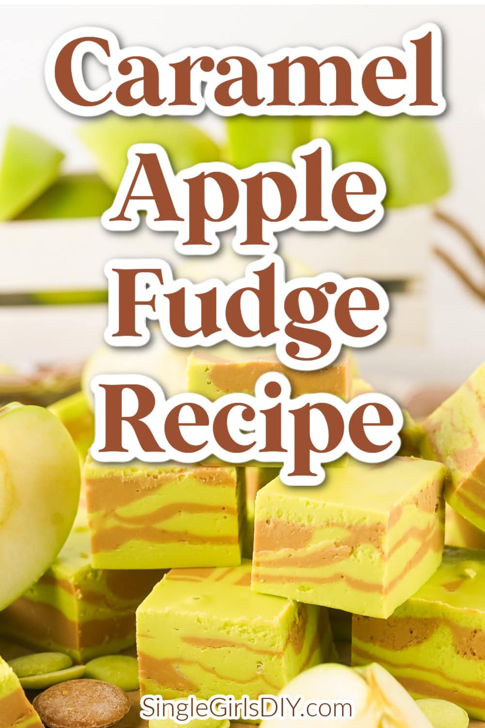 Blocks of caramel apple fudge are stacked on a surface with fresh apple slices nearby. The text "Caramel Apple Fudge Recipe" appears over the image, along with the website SingleGirlsDIY.com.
