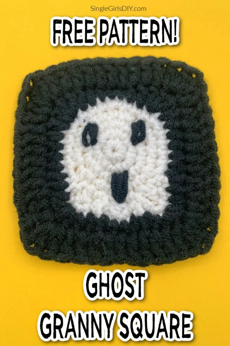 A crocheted ghost granny square features a white ghost face in the center, bordered by black on a yellow background. Text reads “Free Pattern! Ghost Granny Square.”.