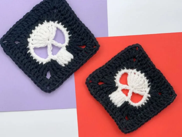 Two crocheted granny squares with white skull motifs are displayed on colored backgrounds, one on purple and one on red.