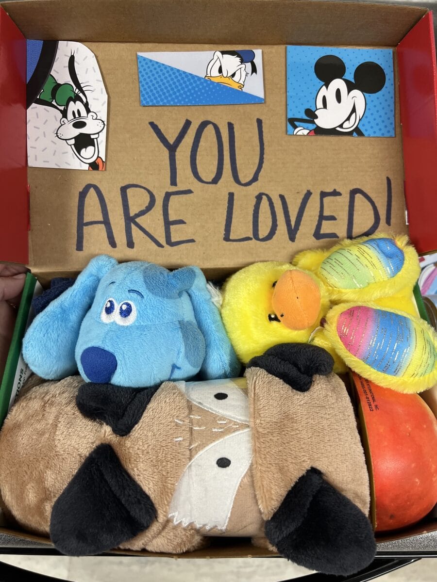 A box with stuffed animals and a note, prepared for Operation Christmas Child.