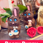 Two chocolate rabbit cocktails, filled with a delicious mix and garnished with mint and paper straws, are surrounded by roses and decorative items. Text reads: "Boozy Bunny Cocktail.